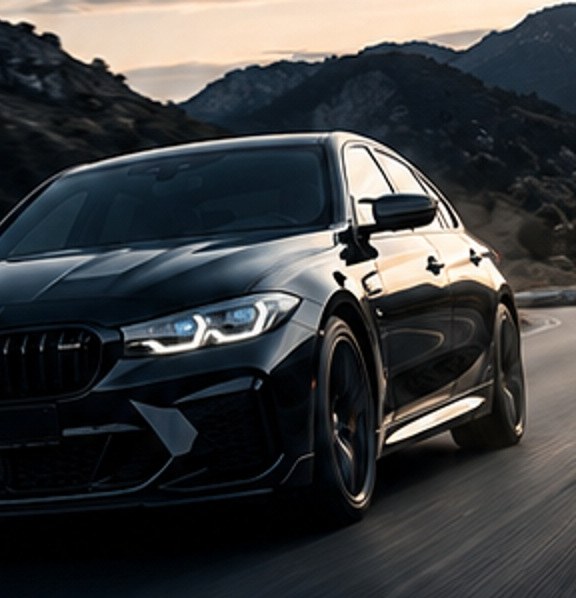 Luxury black sedan on an open road